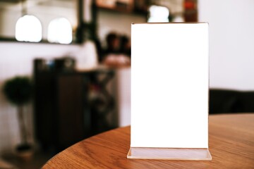 Menu frame standing on wood table in Bar restaurant cafe. space for text marketing promotion.