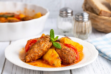 Traditional Homemade Turkish Food Kofte - Kofta with Tomato Sauce and Potatoes. (Turkish name; Izmir kofte)