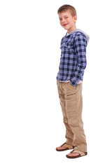 A stylish and fashionable young boy poses for the camera, with his hands casually in his pockets, while showcasing his cute looks, isolated on a PNG background.