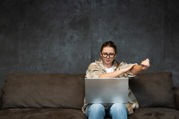 Young girl or woman with a cool attitude freelancer working from home for a foreign modern company...