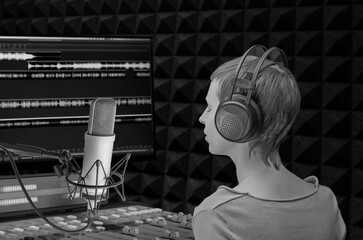girl with headphones in sound studio