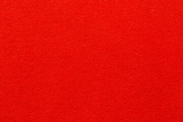 The dark red cloth color texture wall as background.