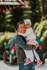 Family time in the park. Father have fun with his daughter in the park, playing fun games and spending time together