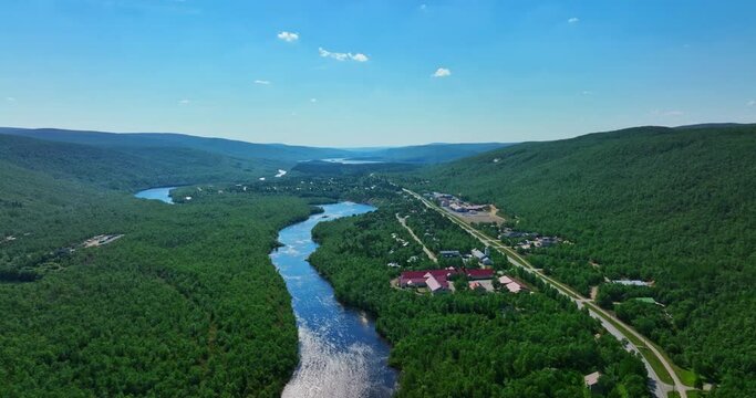 Aerial view of the Utsjoki town and the Stuorraluoppal river, sunny, summer day in Lapland, Finland