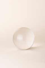 glass sphere on beige background