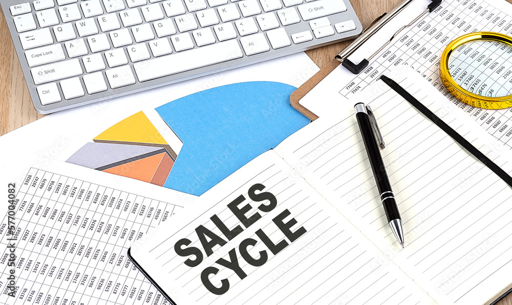 Aufkleber sales cycle text on a paper on chart background