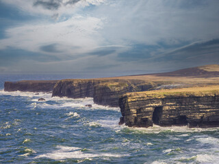 Beautiful scenery of Kilkee cliffs in county Clare, Ireland. Stunning Irish nature landscape. Day...