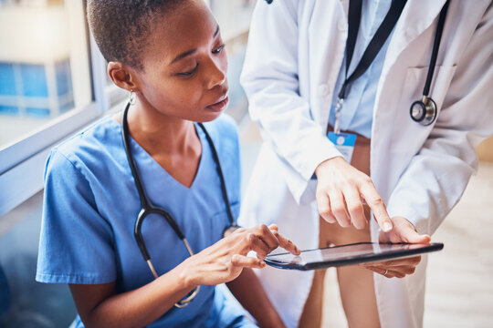 Tablet, black woman or doctors planning surgery in conversation about medical news or tests results in hospital. Teamwork, digital or nurses speaking of online healthcare report or website research