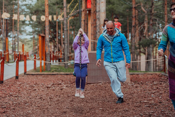 Family time in the park. Father have fun with his daughter in the park, playing fun games and spending time together