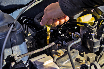 Driver checks the oil level