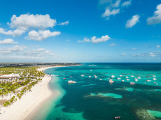 Aerial view of the large tropical beach with white sand and turquoise water of the Caribbean Sea. Best All Inclusive Hotels in Punta Cana