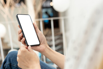 cell phone blank white screen mockup.hand holding texting using mobile on desk at office.background empty space for advertise.work people contact marketing business,technology