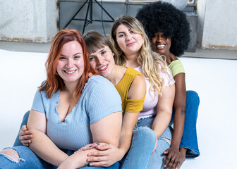 Body Positive and Acceptance, multiracial group of women with different body and ethnicity sitting...
