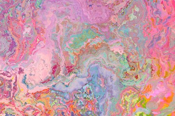 Marbled texture in pastel colors.  Pink liquid background.