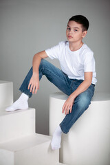 boy in white t-shirt and jeans