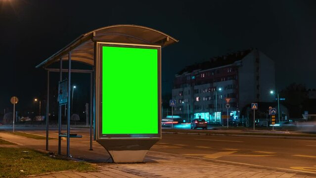 City street bus stop advertising billboard green screen mockup at night