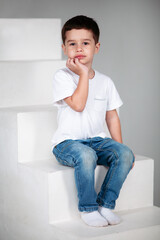 boy in white t-shirt and jeans