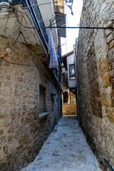 A narrow street by traditional Antakya houses in the old town before the earthquake of 2023. Old...