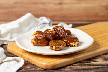 Walnut stuffed figs. Traditional Turkish sweets. Fig dessert with sherbet and walnuts