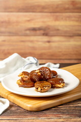 Walnut stuffed figs. Traditional Turkish sweets. Fig dessert with sherbet and walnuts