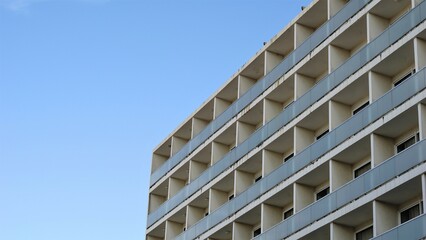 facade with balconies of building against the sky