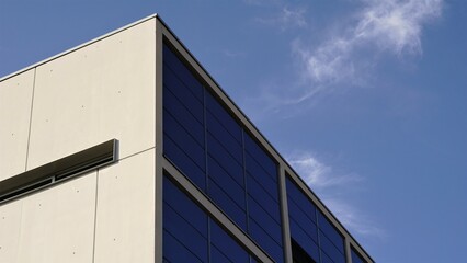 Fototapeta na wymiar corner of modern building facade against the sky