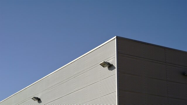 warehouse facade roof corner against the sky