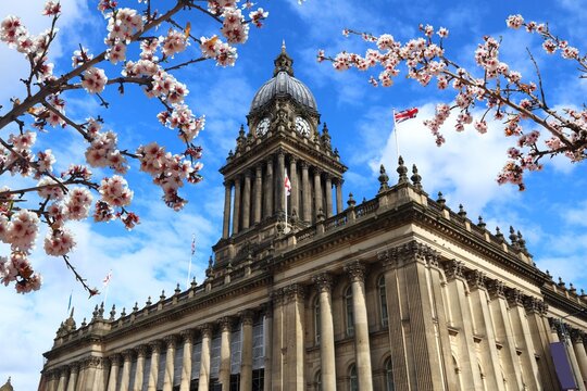 Leeds UK - City Hall. Spring time cherry blossoms.