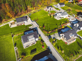 Aerial top down view of newly built houses with solar panels on the roof tops