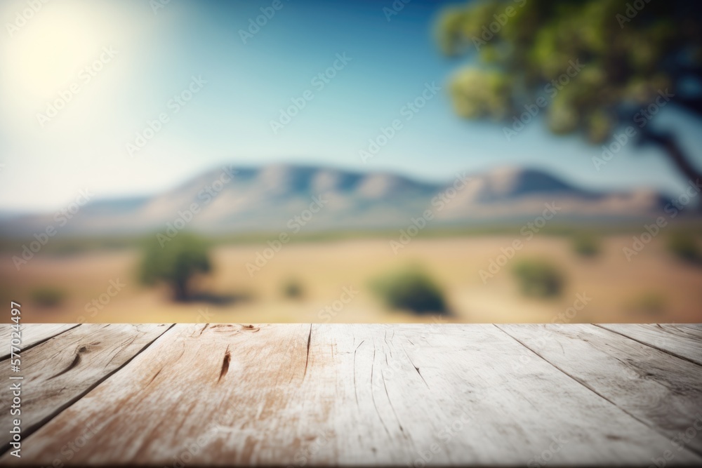 Poster a wooden table top with a blurry background of mountains in the distance with a tree in the foregrou