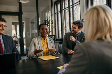 Female candidate apply for position, interview in modern office, recruiters consider applicant...