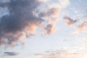 Light pastel clouds at sunset in summe
