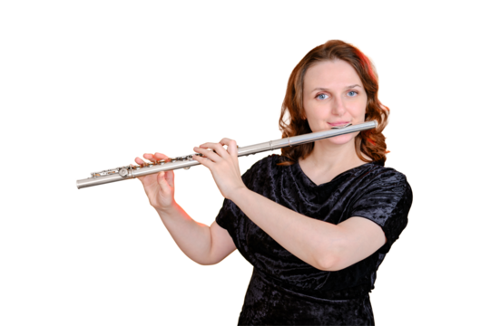 Portrait of a woman musician with a flute on a studio isolated white background. Flutist with a large concert transverse flute in her hands