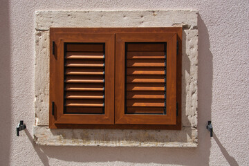 modern wooden window shutters closed