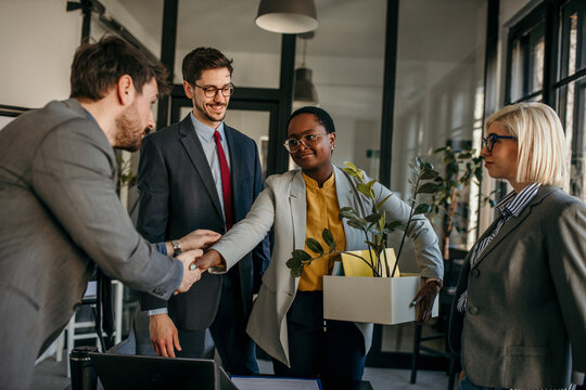 Handshake, Partnership, And Congratulations After Hiring A New Employee Or Leadership Promotion With Applause. Business Colleagues Welcome A New Female Employee.