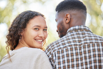 Obraz premium Portrait, love and a couple in the park together for a romantic date for their anniversary celebration during summer. Face, spring and romance with an attractive young female dating her boyfriend