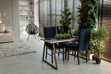 Stylish apartment interior with modern kitchen. Modern living room with kitchen. Idea for home design. Beautiful living room. A modern, stylish and bright living room. Designer house. Cozy apartment.