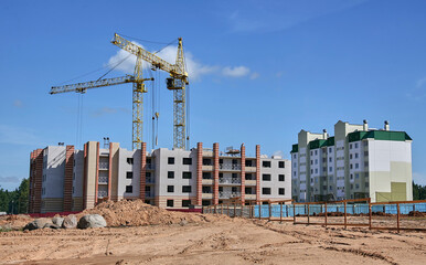Panoramic view of construction sites and many cranes working