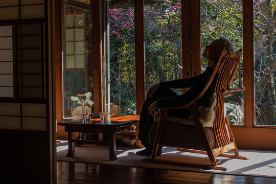 woman sitting near the window in japanese old hous