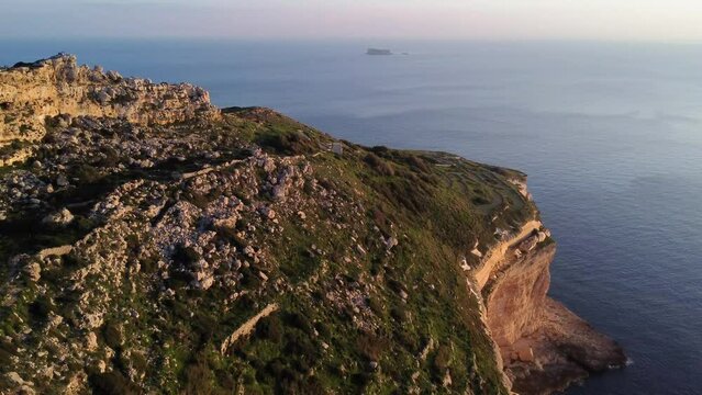 Drone shot of Dingli Cliff and Filfla island  in Malta, sunset time