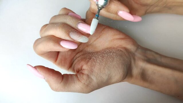 Gel Polish Removal Procedure. Removing The Coating With A Ceramic Cutter. Manicure At Home.
Removal Of Old Nail Polish