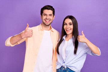 Photo of two people optimists wear casual pastel shirt students recommend their new university thumbs up isolated on violet color background