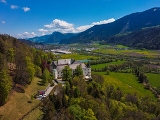 Aerial view Tratzberg castle in Stans, Tirol. Austria by drone. Alps mountains. River Inn.