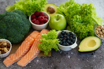 Healthy food clean food selection: fruits, vegetables, superfoods, salmon fish, leafy vegetable