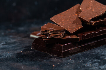 Chocolate bars on a dark background close-up