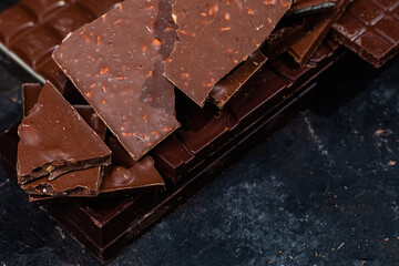 Chocolate bars on a dark background close-up