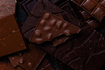 Chocolate bars on a dark background close-up