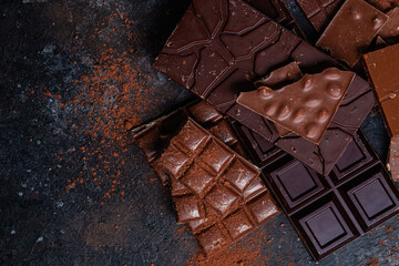 Chocolate bars on a dark background close-up