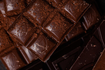 Chocolate bars on a dark background close-up