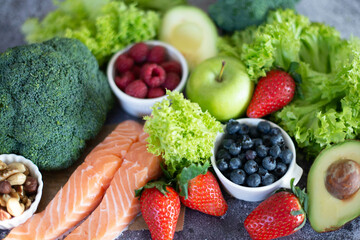 Healthy food selection: fruits, vegetables, nuts, superfoods, berries, leafy vegetables